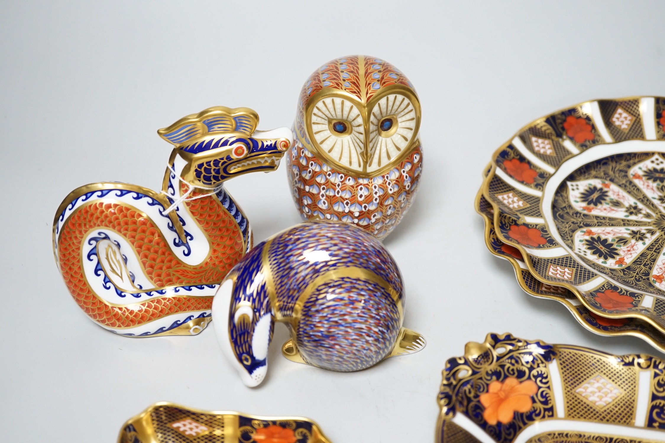 Four various Royal Crown Derby 1128-pattern dishes, plates 21cm, and three Royal Crown Derby paperweights